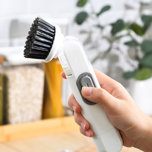 Brosse à pot avec distribution automatique de liquide